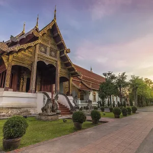 Wat Phra Singh temple pavilion at pink sunrise