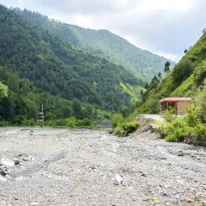 Water flowing over river rocks near mountains in Nathia Gali Water flowing over river rocks near mountains in Nathia Gali