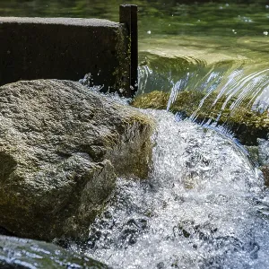 Water flows through an open dam Water flows through an open dam