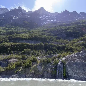 Waterfall, floating ice, mountain range