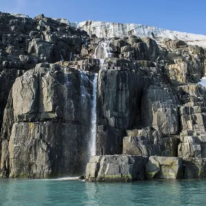 Waterfall in a glacier on Alkefjellet Waterfall in a glacier on Alkefjellet