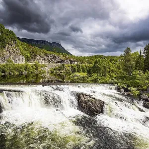 The western Norway. Magnificent seething waterfall - the threshold on the river Bioreio