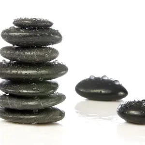 Wet zen stones isolated over a white background