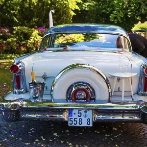 White Cadillac with champaign glasses