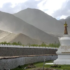 White choerten at wall of Samye Monastery with mountains Tibet China