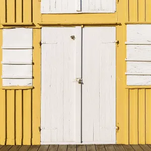 White door and window, front side yellow boathouse White door and window, front side yellow boathouse