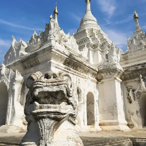 White Pagoda at Inwa ancient city with lions guardian statues White Pagoda at Inwa ancient city with lions guardian statues