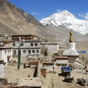 White stupa with colourful prayer flags and Mt