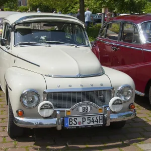 A white Volvo classic car stands in the sun A white Volvo classic car stands in the sun