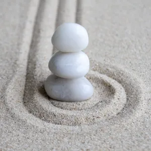 White Zen stones on circles formation with customizable space for text