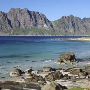 Wide beach with clear blue water and rocks Wide beach with clear blue water and rocks