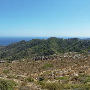 Wide landscape on the hiking trail from Avlona to Diafani with mountains stretching to the sea Wide landscape on the hiking trail from Avlona to Diafani with mountains stretching to the sea