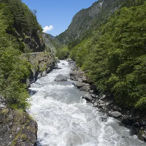 Wild water flows through a rocky valley Wild water flows through a rocky valley