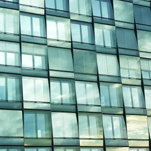 Window pattern of modern city with scenic sky reflection