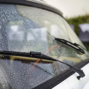 Windscreen wiper on a classic car oldtimer Windscreen wiper on a classic car oldtimer
