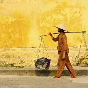 Woman carrying goods, Hoi An, Vietnam Woman carrying goods, Hoi An, Vietnam