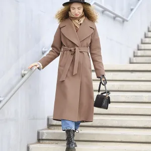 A woman with curly hair is walking down the stairs A woman with curly hair is walking down the stairs