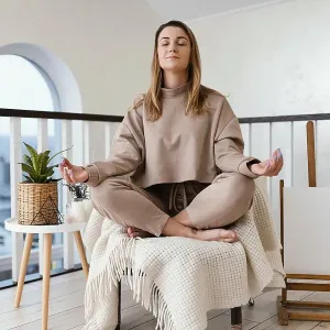 Woman meditating indoor