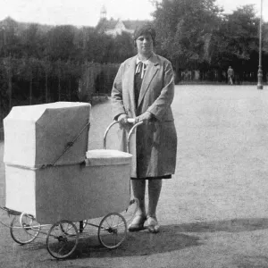 Woman with a pram, historic photograph Woman with a pram, historic photograph