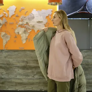 A woman stands at a reception area