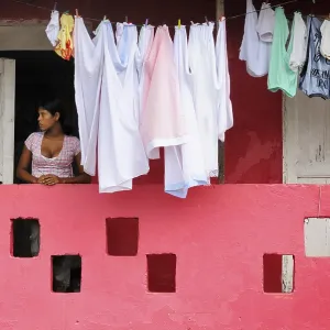 Woman next to washing on the line Woman next to washing on the line