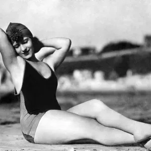 Woman wearing a bathing suit, historic photograph Woman wearing a bathing suit, historic photograph
