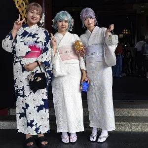 Three woman wearing white kimonos pose in front of Senso-ji in Asakusa Three woman wearing white kimonos pose in front of Senso-ji in Asakusa