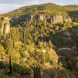 Wooded rocky gorge valley sides with cypress trees Wooded rocky gorge valley sides with cypress trees