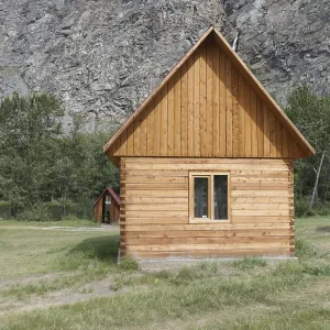 Wooden camping cabin near mountains Wooden camping cabin near mountains