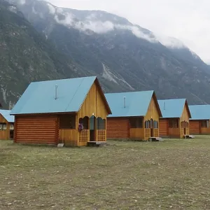 Wooden camping cabins near mountains Wooden camping cabins near mountains