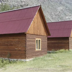Wooden camping cabins near mountains Wooden camping cabins near mountains