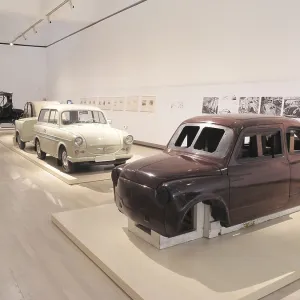 Wooden model of a Fiat 600 and a Trabant with a trailer