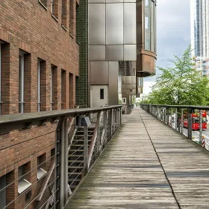 Wooden pedestrian walkway surrounded by modern and historic architecture in Hamburg Wooden pedestrian walkway surrounded by modern and historic architecture in Hamburg
