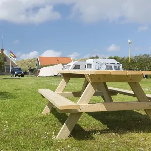 Empty wooden picnic bench at camping