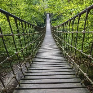Wooden suspension bridge over a gorge Wooden suspension bridge over a gorge