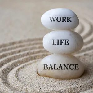 Work life balance text on zen stones with sand background