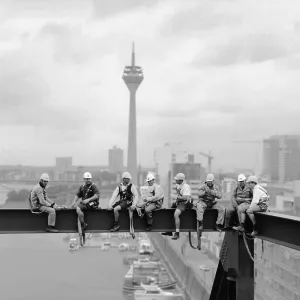 Workers sitting on a steel beam Workers sitting on a steel beam