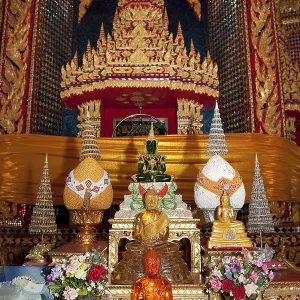 Worship room with Buddhist symbols and small statue of Buddha