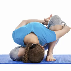 Yoga, young beautiful slender woman yoga instructor doing Forward Bends Sage Twist B pose (Marichyasana B)