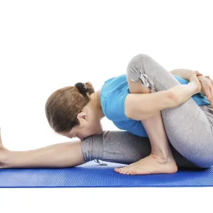 Yoga, young beautiful slender woman yoga instructor doing Forward Bends Sage Twist A pose (Marichyasana A)