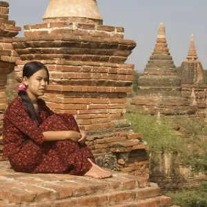 Young Burmese woman on the roof of a temple Young Burmese woman on the roof of a temple