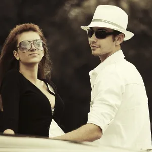 Young fashion couple at the classic car