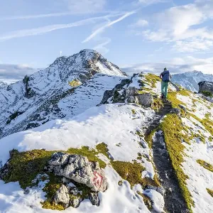 Young female hiker on hiking trail to Kramerspitz Young female hiker on hiking trail to Kramerspitz