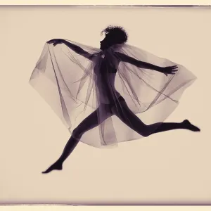 Young jumping woman with wing veil Young jumping woman with wing veil