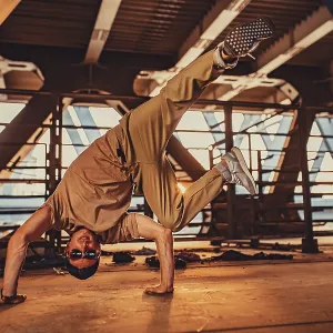Young man break dancing on urban background Young man break dancing on urban background