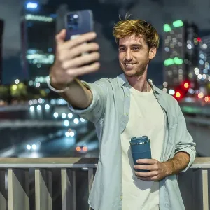 Young man standing on a bridge Young man standing on a bridge