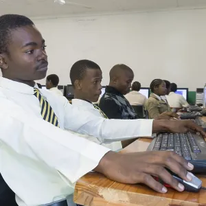 Young people working on computers Young people working on computers