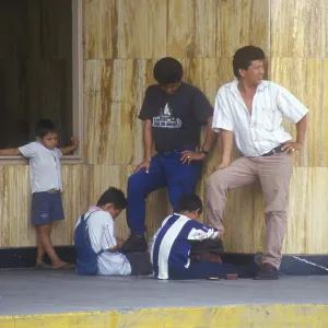 Young shoe cleaner at work in Iquitos Young shoe cleaner at work in Iquitos