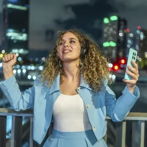 Young Woman Dancing on City Bridge Nighttime Print