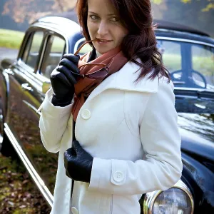 Young woman at a Mercedes Ponton 220SE built in 1959